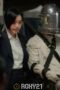 a woman in a suit and a helmet