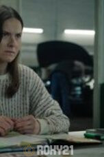 a woman sitting at a desk