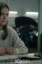 a woman sitting at a desk