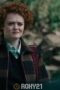 a woman with curly red hair